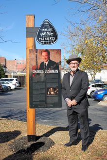 Bluegrass Artist Charlie Cushman stands by his TN Music Pathways marker in Clarksville, Tenn. when it was installed in November 2020.