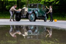 L/R: Explorer Scouts Miles McCarthy, 17 and Alex Raisin-Moss,16 clean their founder’s car before starting work in the Great British Car Journey’s workshop to gain their Mechanic Activity Badge.
