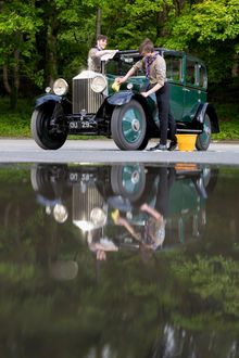 L/R: Explorer Scouts Miles McCarthy, 17 and Alex Raisin-Moss,16 clean their founder’s car before starting work in the Great British Car Journey’s workshop to gain their Mechanic Activity Badge.