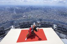Kabuki actor Ichikawa Ebizo performs at the topmost point of the Tokyo Skytree broadcasting tower on May 22, 2022, during a ceremony marking the 10th anniversary of the tower's opening.