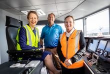 Minister Di Farmer (seated), Chris Briggs (SeaLink GM NQ) and Joan Pease MP