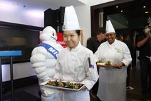 MICHELIN and Destination Vancouver sign the menu at today’s announcement of the MICHELIN Guide Vancouver