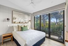 Sleeping by the river in the new Urunga cabins by Reflections