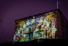 Festive projections onto Norwich's medieval castle