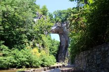 Nat ural Bridge State Park is a 215 - foot tall natural limestone arch located in Rockbridge County, VA.