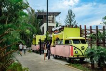 Colourful vintage vans offering Indian Vegetarian food & local snacks