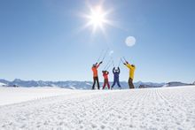 A family pictured on the slopes