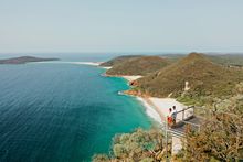 Couple enjoying the coastal views along Tomaree Head Summit Walk, Port Stephens
