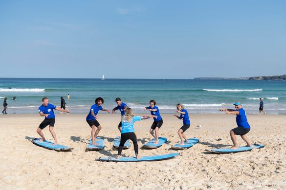 Small group enjoying a learning to surf experience with Lets Go Surfing, Bondi Beach