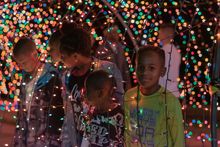 Children enjoy one of the colorful light displays at Christmas on the Cumberland.