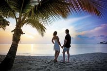 Couple on beach at East Winds