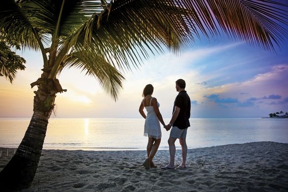 Couple on beach at East Winds