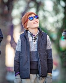 Child wearing EnChroma glasses