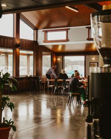 Patrons enjoying the cosy interior of The Artisan Farmer 