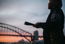 Margret Campbell performing a smoking ceremony at Blues Point Reserve, Blues Point in Sydney as part of the Dreamtime Southern X experience