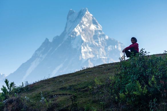 A local boy watches as the group treks past, Annapurna region, Nepal