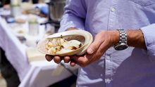 Coral Expeditions guests sampling Abalone
