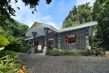 The Lab, an educational and activity hub for guests that’s made of upcycled glass bottles and other waste materials; seeds collected for cultivation at the Native Tree Nursery by Wildlife For The Future pillar team; 