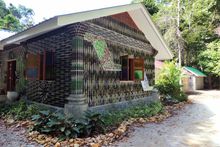 The Lab, an educational and activity hub for guests that’s made of upcycled glass bottles and other waste materials; seeds collected for cultivation at the Native Tree Nursery by Wildlife For The Future pillar team; 