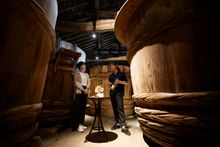 Fermented foodie day - one of the many courses takes place between the tall soy sauce barrels