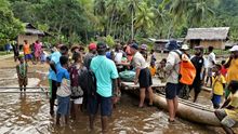 Siboma Village - Locals recieving supplies and gifts from Coral Expeditions crew and guests