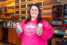 Kaitlin Fahy, operations manager at Forbes Trail Brewing, displays two of the brewery’s products in Stoystown.