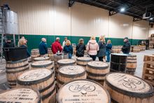 Ponfeigh President Maximilian Merrill (rear) answers questions during a group tour of the distillery in Somerset.