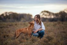 Zali Jestrimski with dingos Eulalia and Steven, Wooleen Station