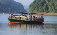 Photo of an overhead boat riding along a river 