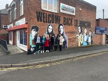 Outside the current Power In Partnership centre, with Susan Nickson and representatives from Power in Partnership.