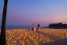 Beach candlelit dinner at Mulia Bali overlooking the Geger Temple