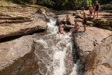 The Meadow Run Natural Waterslides make Ohiopyle in Pennsylvania's Laurel Highlands region a popular summer travel destination.