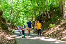 Families enjoy the scenic beauty along the 9-mile Clarksville Greenway.