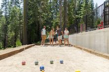 Bocce ball set arranged on an outdoor bocce court.