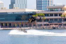 Crowds of onlookers watch a U.S. Army MH-6 Helicopter fly over the Garrison Channel outside the Tampa Convention Center May 8 as part of a Live Capabilities Demonstration during SOF Week 2024. Hillsborough County’s tourism industry saw its best June in hi