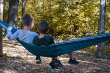 Brothers enjoy a trailside hammock at Clarksville's Rotary Park.