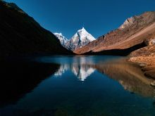 Mount Jichu Drake reflected in Sophu lake, Jigme Dorji National Park, Bhutan