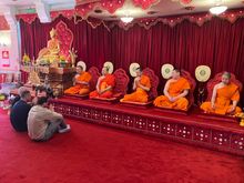 Will Mellor and Ralf Little inside Wat Phra Singh UK with the resident monks