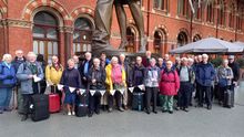 Celebratory tour group meet at St Pancras, London