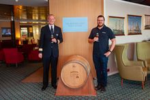 Bradley Adnams with Hotel Manager Iain Gibson with the cask on Borealis in January