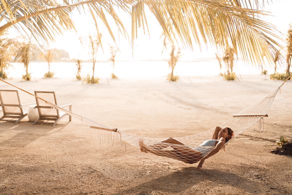 Relax in Maldivian style in hammocks all around Kandooma.