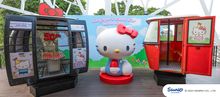 Hello Kitty sculpture in signature red bow and blue overalls