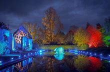 Spectacle of Light Christmas Light Trail at Sudeley Castle. Photos shows the Castle's Tithe Barn Ruins and Carp Lake with a polar bear installation