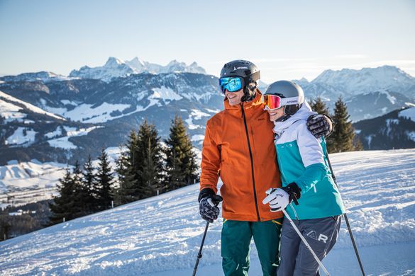 A couple on the slopes in St. Johann in Tirol.