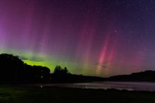 The northern lights shine over Acme Dam in Pennsylvania's Laurel Highlands.