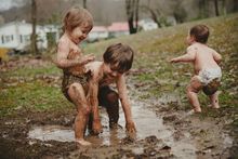 Children play in the mud in Pennsylvania's Laurel Highlands.