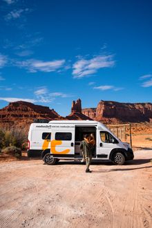 roadsurfer camper van in a desert landscape.