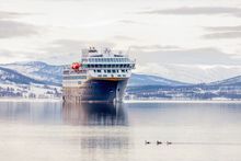 Havila Capella in calm winter scenery.