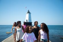 Family visiting Ludington North Breakwater Light (100th anniversary in 2024)