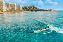  Catching a wave on an outrigger canoe 